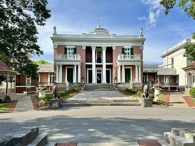 Belmont Mansion — the columned front facade with its twin lion statues
